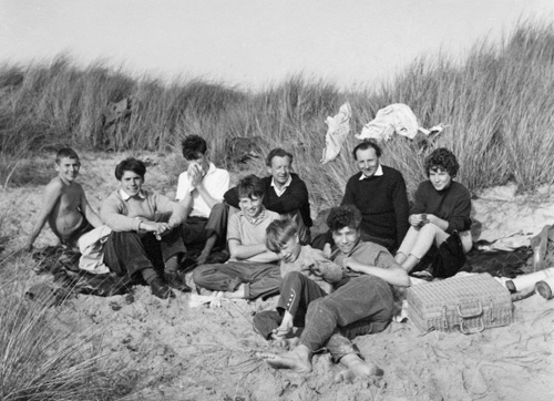 From right, Michael, Lennox, Nicholas and Julian Berkeley, with Benjamin Britten and boys from Westminster Cathedral Choir School (Blakeney Point, Norfolk, 1961)